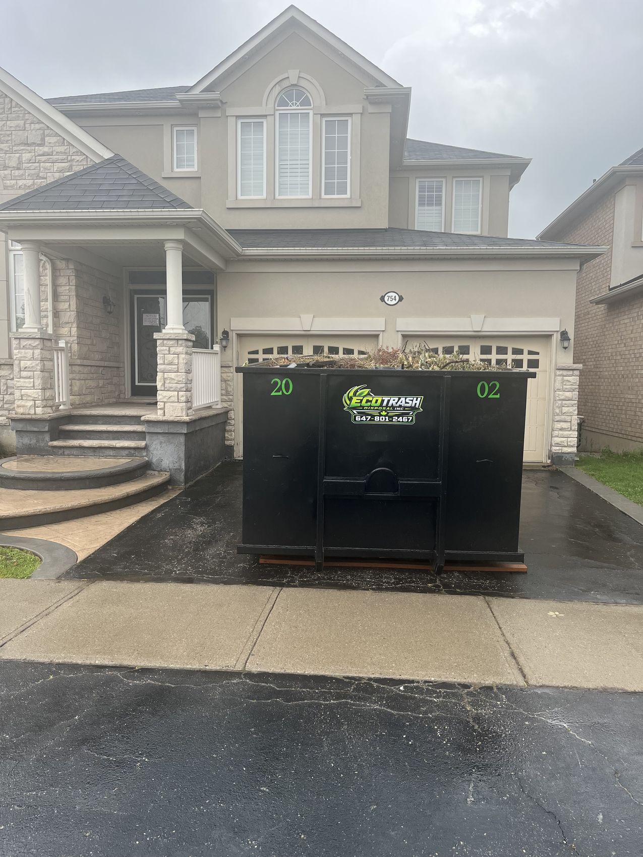 A filled 20 yard Eco Trash bin ready for pickup